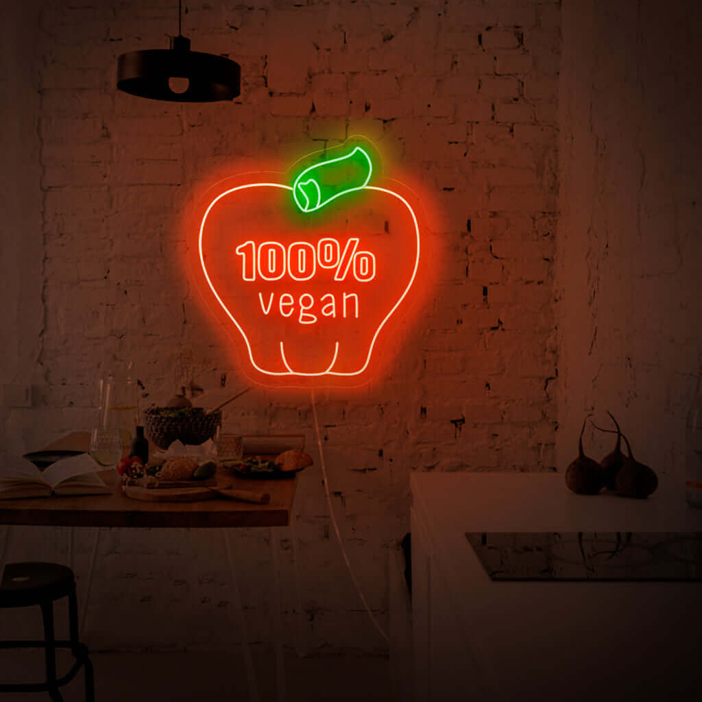 "100% Vegan With Apple Neon Sign" apresenta um design vibrante e ecológico, exibindo com orgulho o símbolo da maçã como uma prova do seu comprometimento com um estilo de vida baseado em vegetais.