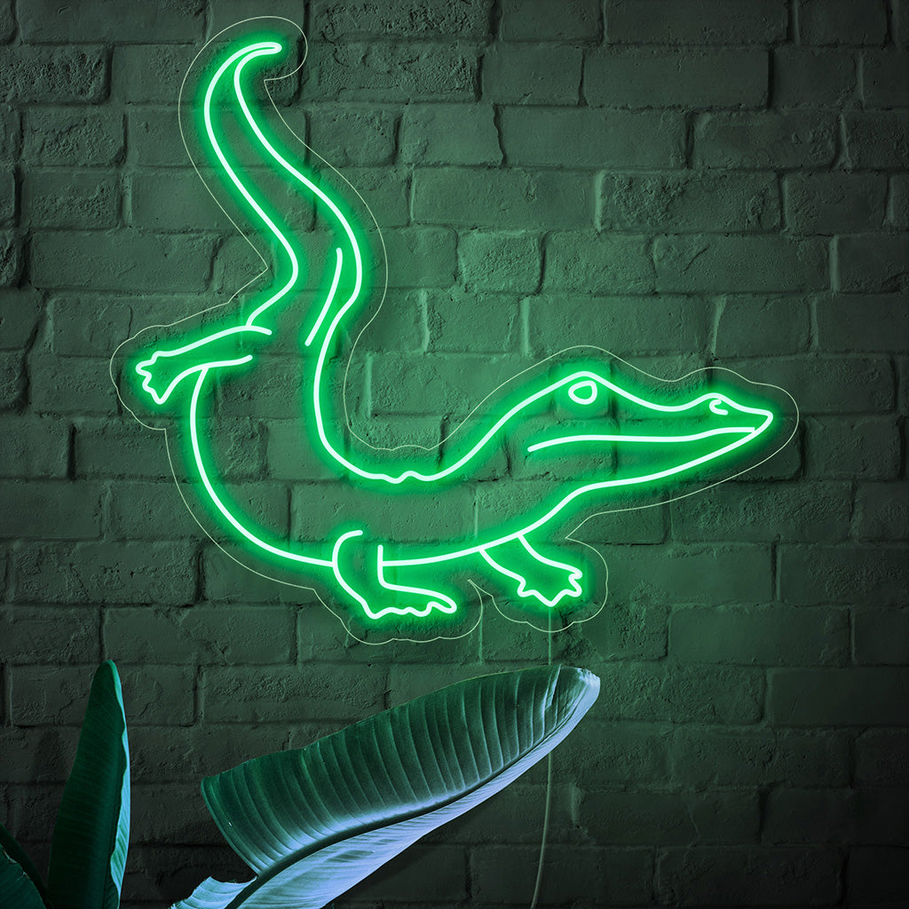 "Placa de neon de crocodilo" ��� Uma luz neon ousada e exótica que exibe a silhueta de um crocodilo, infundindo seu espaço com energia intensa e charme aventureiro.