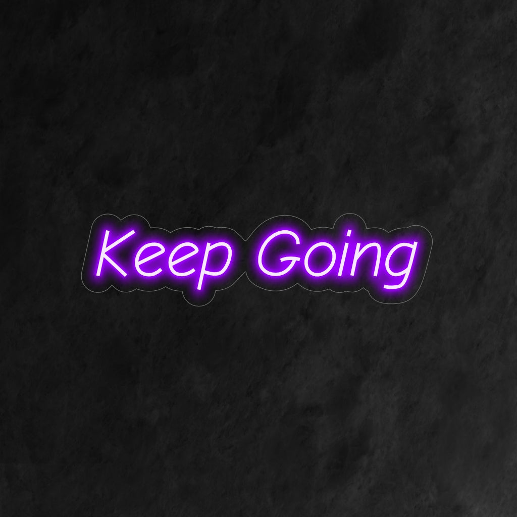 O letreiro neon "Keep Going" emana motivação e positividade, perfeito para espaços que precisam de um impulso extra.