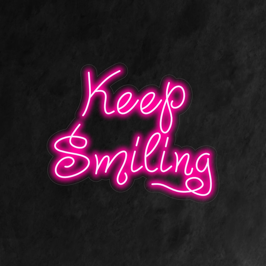 "Placa de neon "Keep Smiling" é uma adição motivacional e positiva para o seu interior. Uma luz neon que serve como um lembrete diário para manter um humor alegre.
