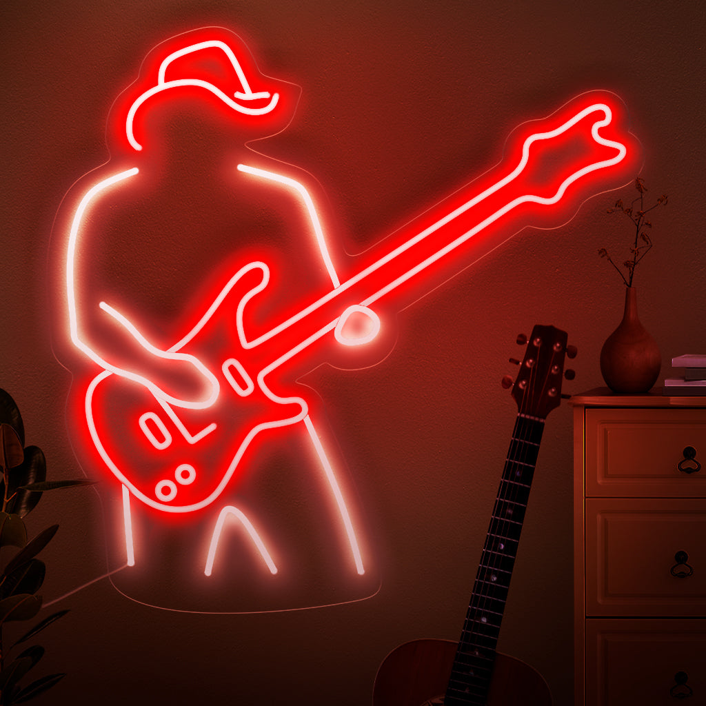 O letreiro de neon "Um Homem Toca Guitarra" captura a essência da paixão musical com uma silhueta dedilhando um violão. Eleve seu espaço com o brilho rítmico desta elegante e cativante luminária de neon.