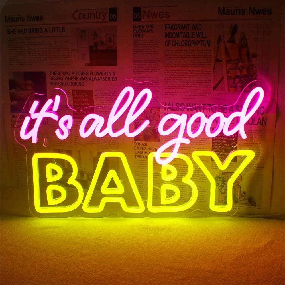A imagem apresenta uma vibrante placa de LED neon com os dizeres "It's All Good Baby", criada com uma fonte moderna e elegante.