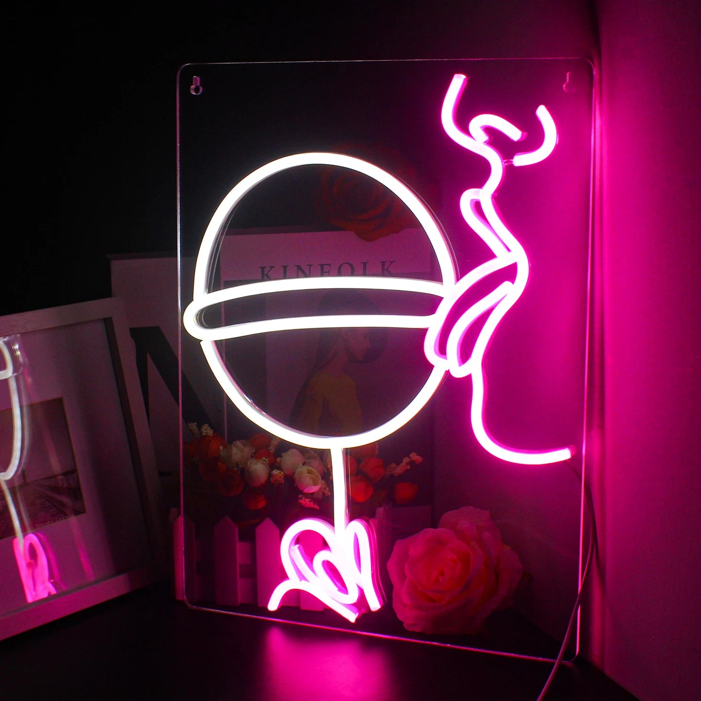 Uma vibrante placa de LED neon feita à mão com a palavra "Festa" escrita em letras cursivas.