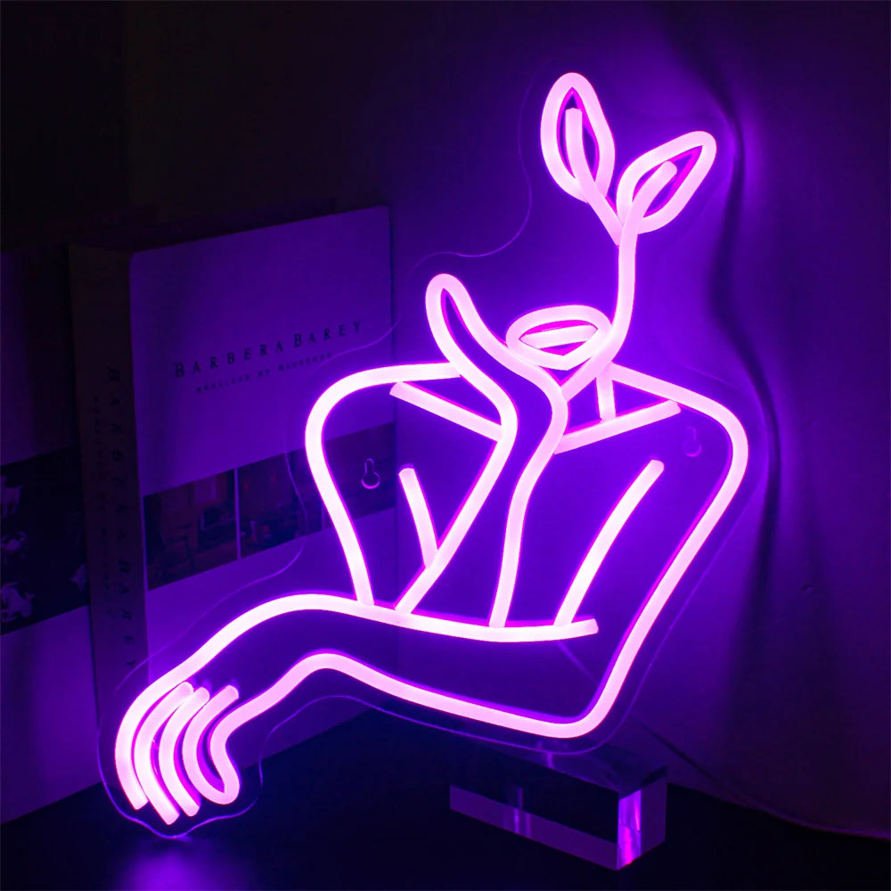 A imagem apresenta um elegante letreiro de LED neon representando uma arte minimalista do rosto de uma mulher.