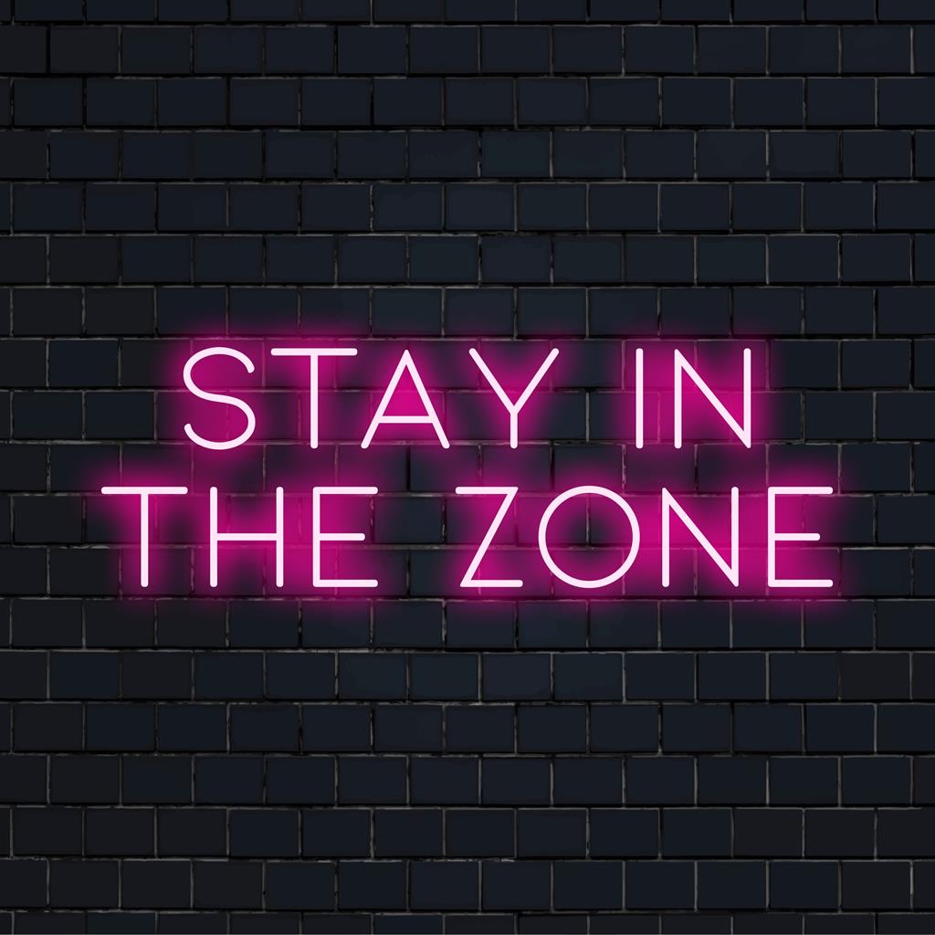 Placa de neon LED exibindo a frase Stay In The Zone, perfeita como decoração motivacional de luz neon ou arte de parede neon personalizada.
