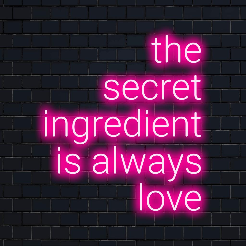 Placa de neon LED personalizada com a frase "O ingrediente secreto é sempre amor" em uma cursiva cativante, perfeita para qualquer decoração de parede.