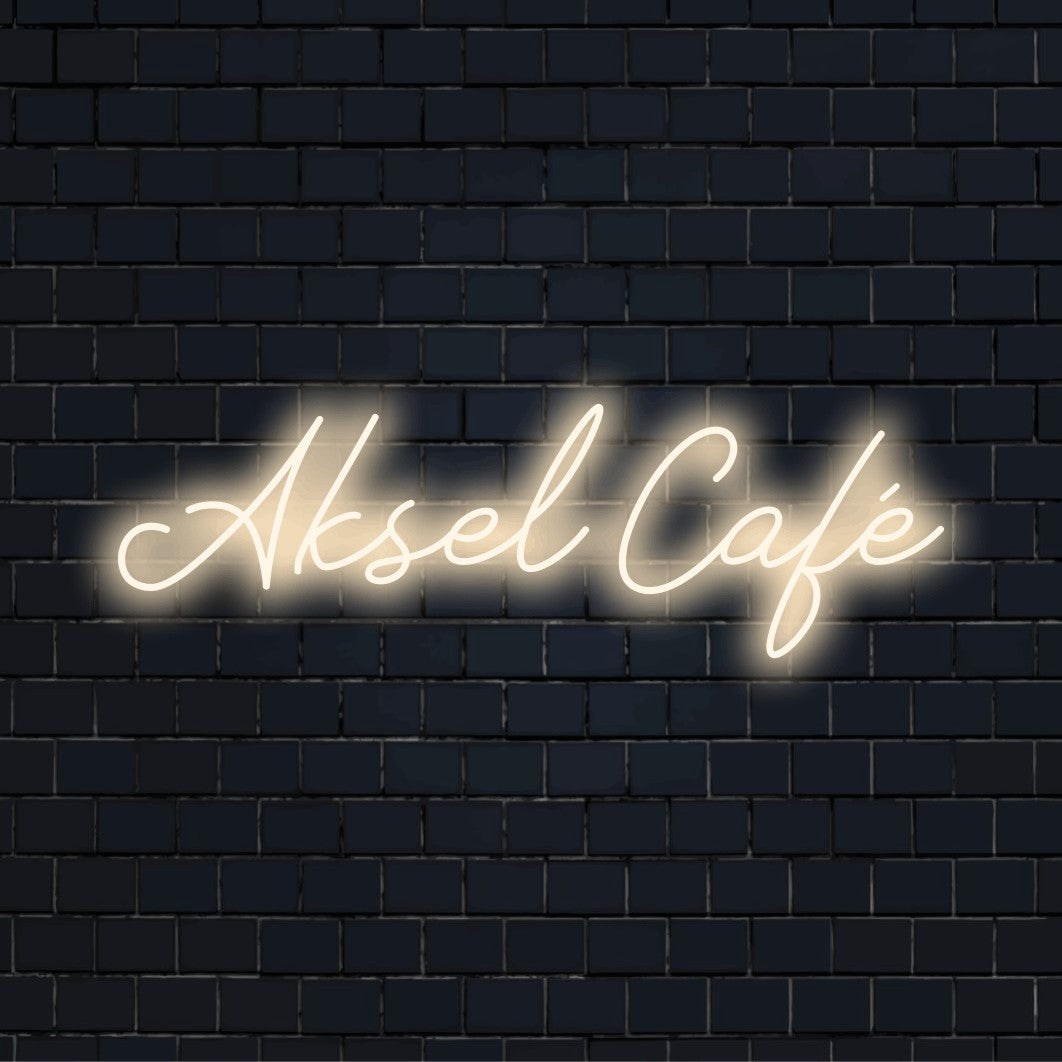 Aksel Cafe Custom Name Neon Sign, bright neon lettering on dark brick wall