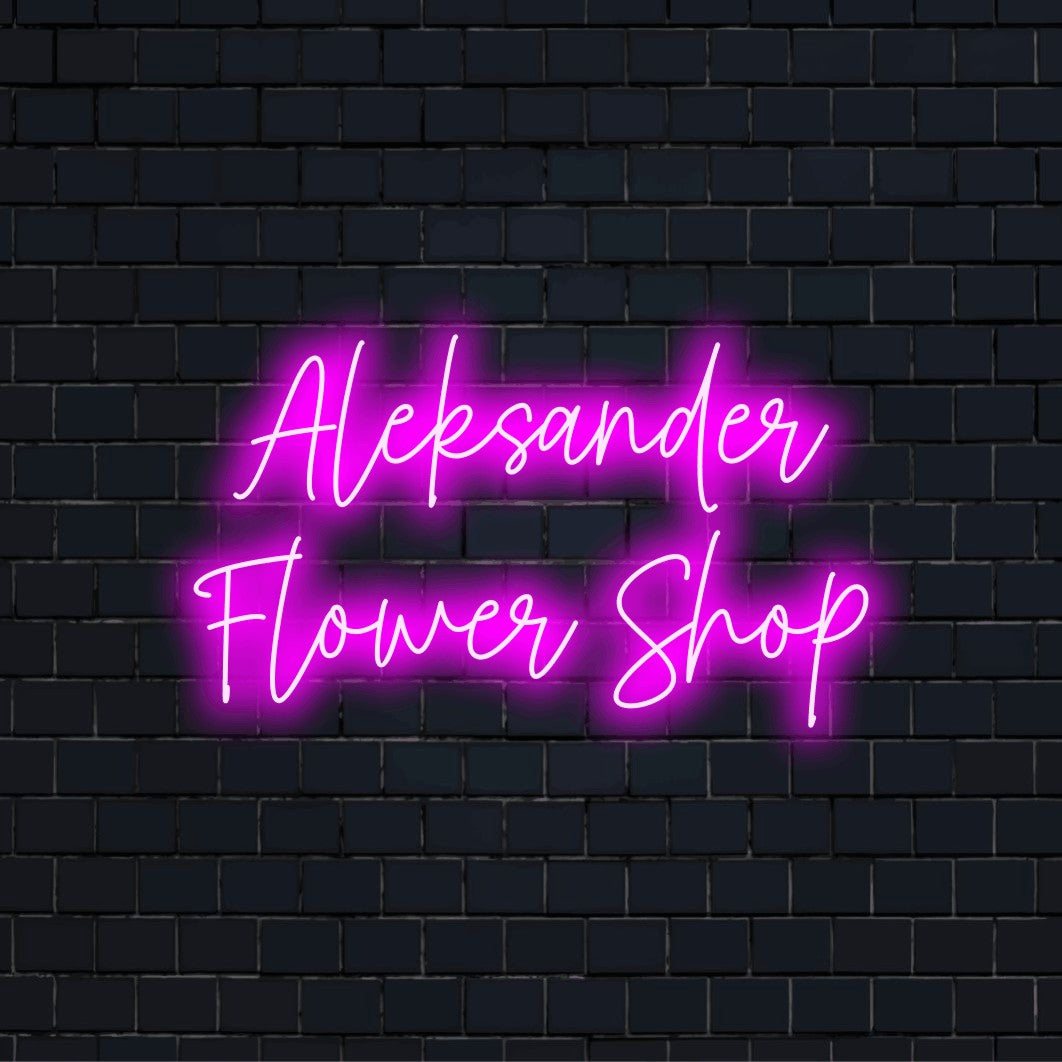 Aleksander Flower Shop Personalized LED Neon Sign, neon text light against black brick wall