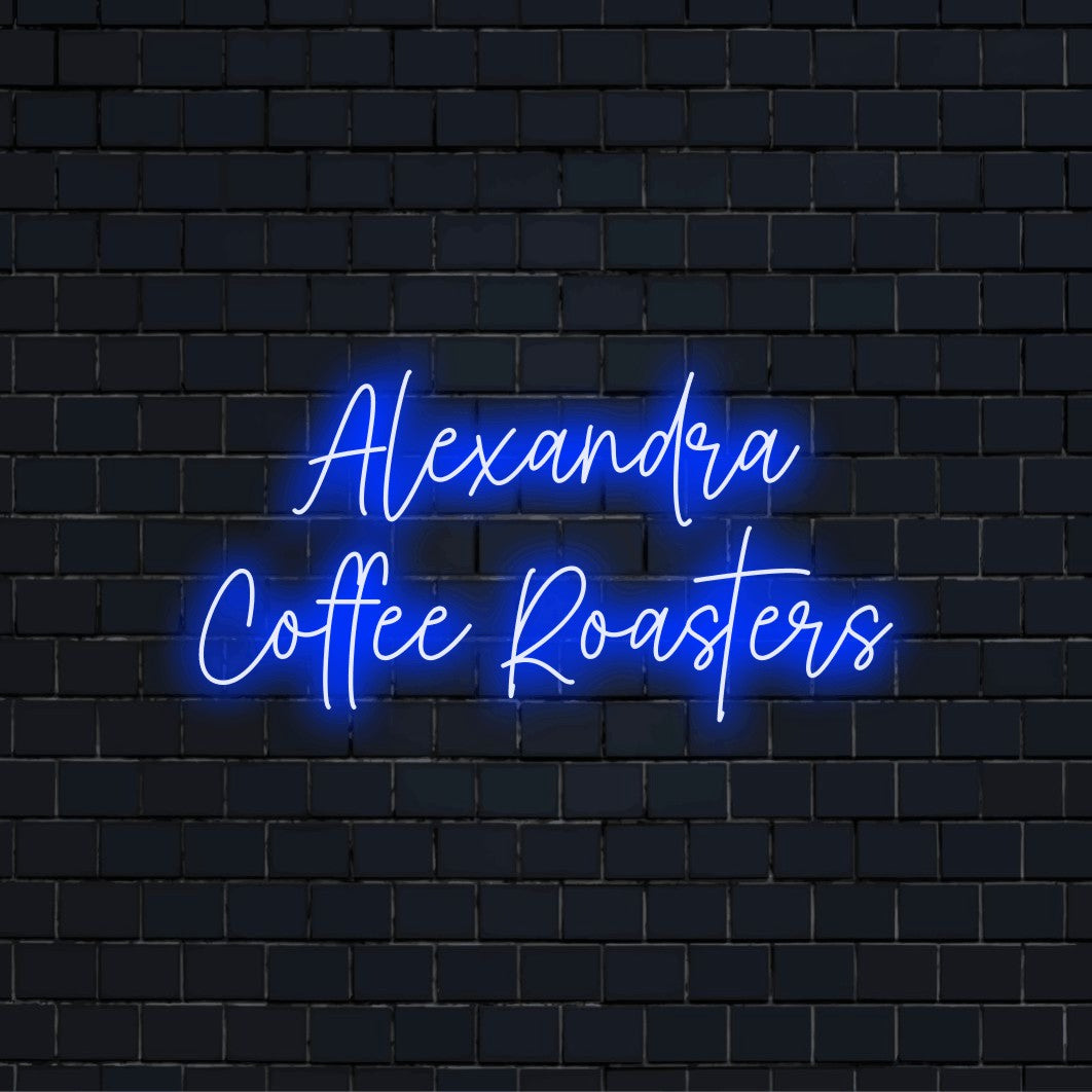 Alexandra Coffee Roasters Personalized Neon Light with glowing wall decor on black brick background