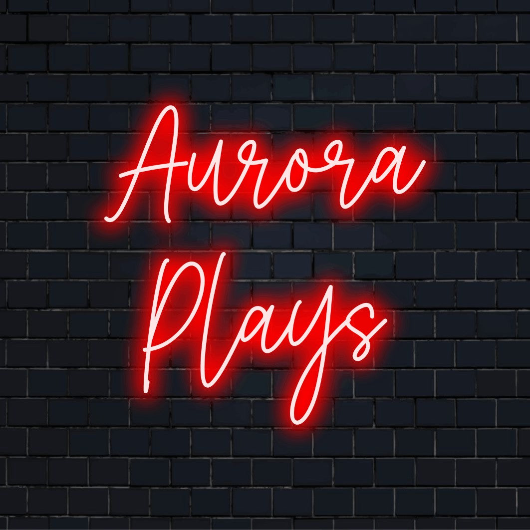 Aurora Plays Personalized Neon Light with glowing neon text on black brick background