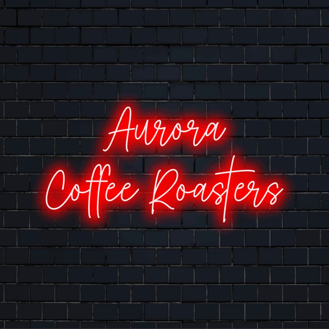 Aurora Coffee Roasters Custom Name Neon Sign, bright neon lettering on black brick background