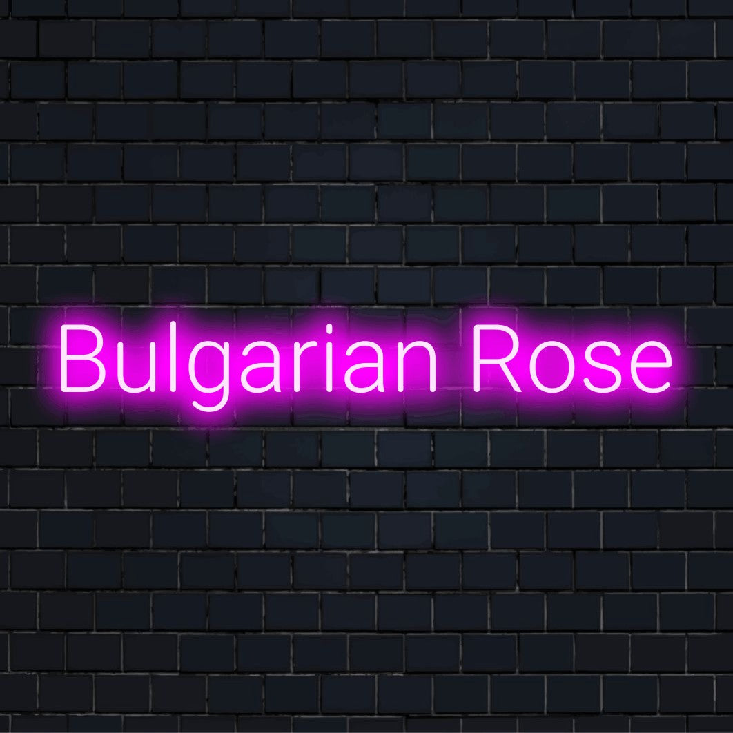Bulgarian Rose Neon Light with glowing lettering against brick backdrop
