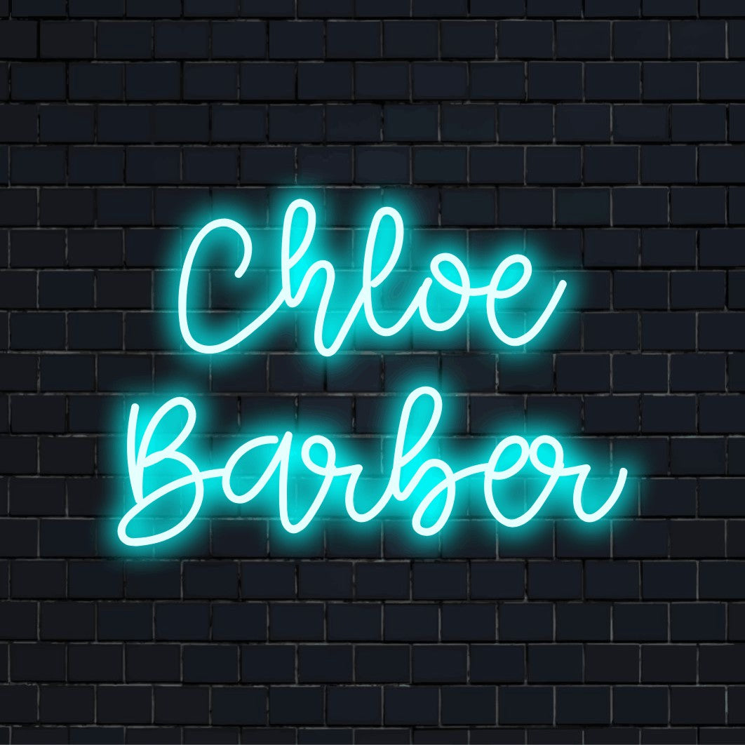 Chloe Barber Personalized Neon Light with glowing lettering on black brick background