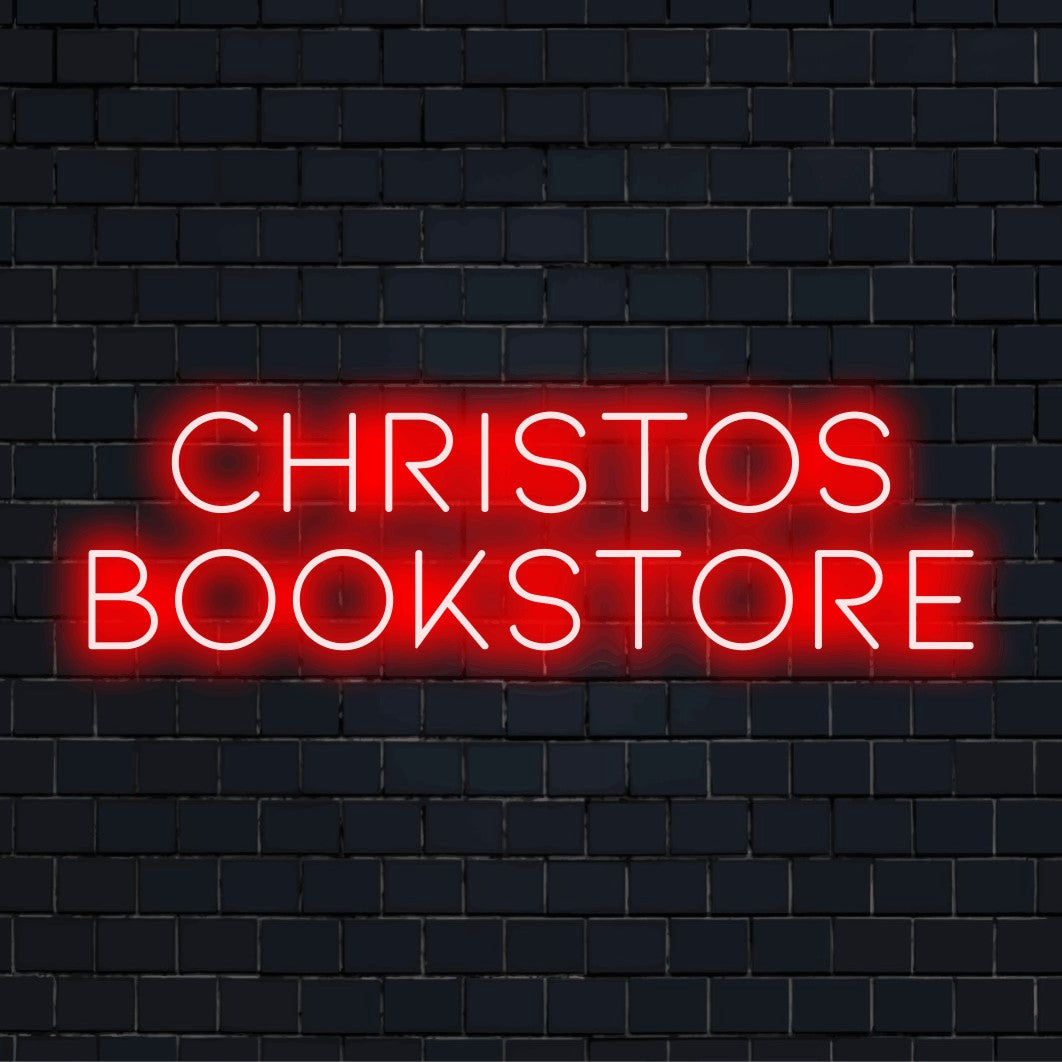 Christos Bookstore Personalized LED Neon Sign, glowing lettering against black brick wall