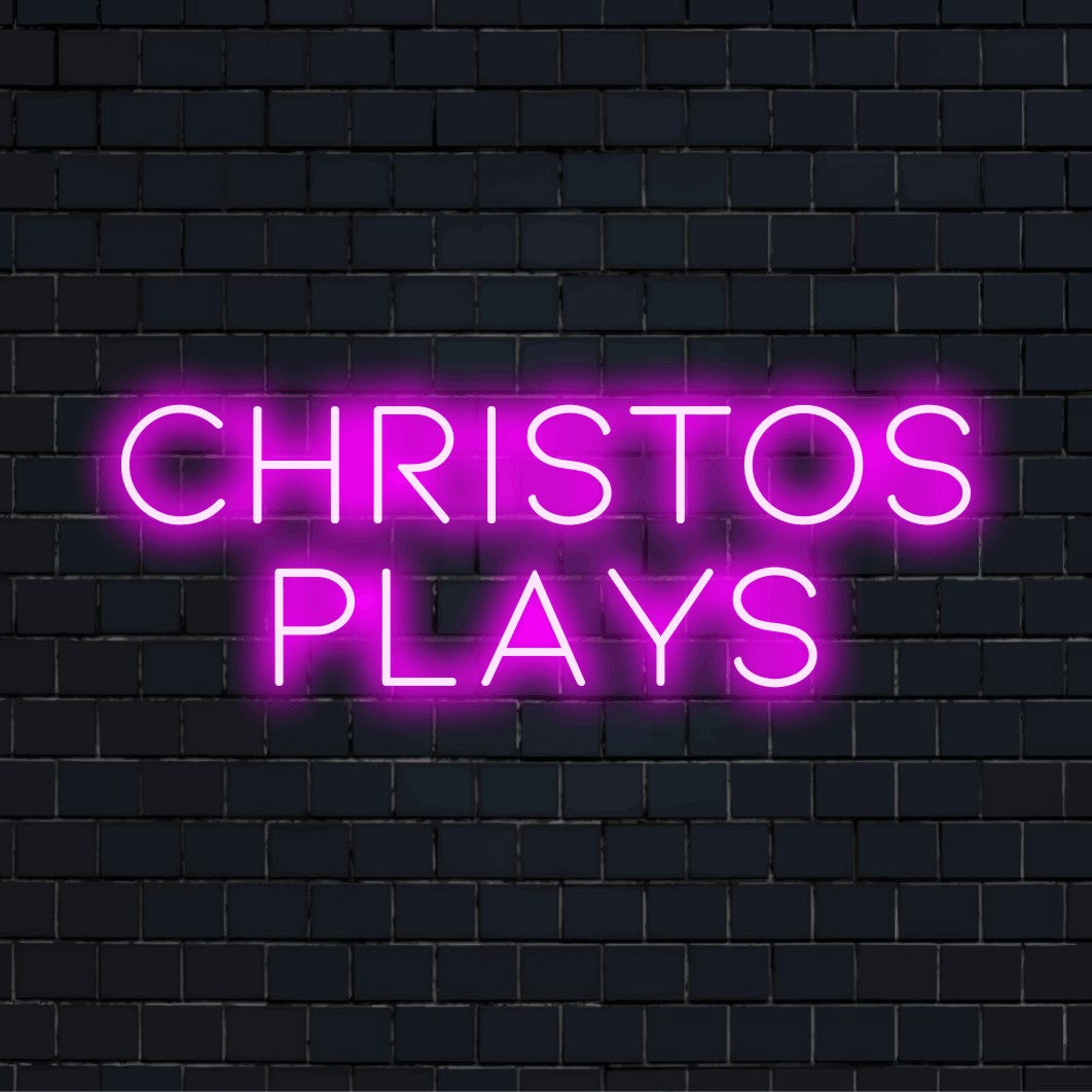 Christos Plays Personalized Neon Light with glowing wall decor on dark brick wall