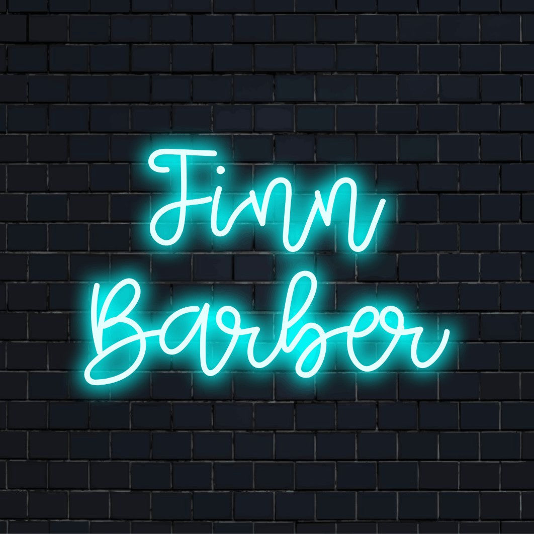 Finn Barber Personalized Neon Light with soft neon glow on black brick background