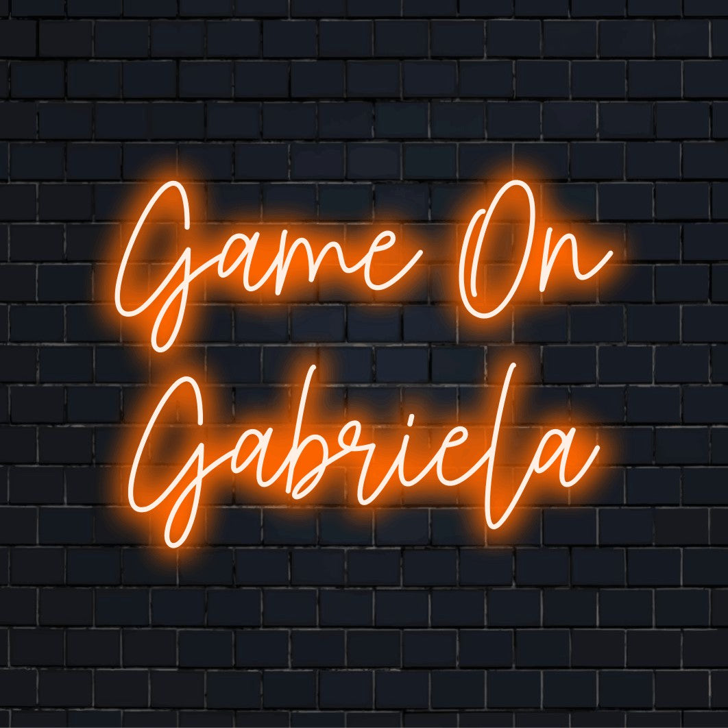 Game On Gabriela Personalized LED Neon Sign, bright neon glow on dark brick background