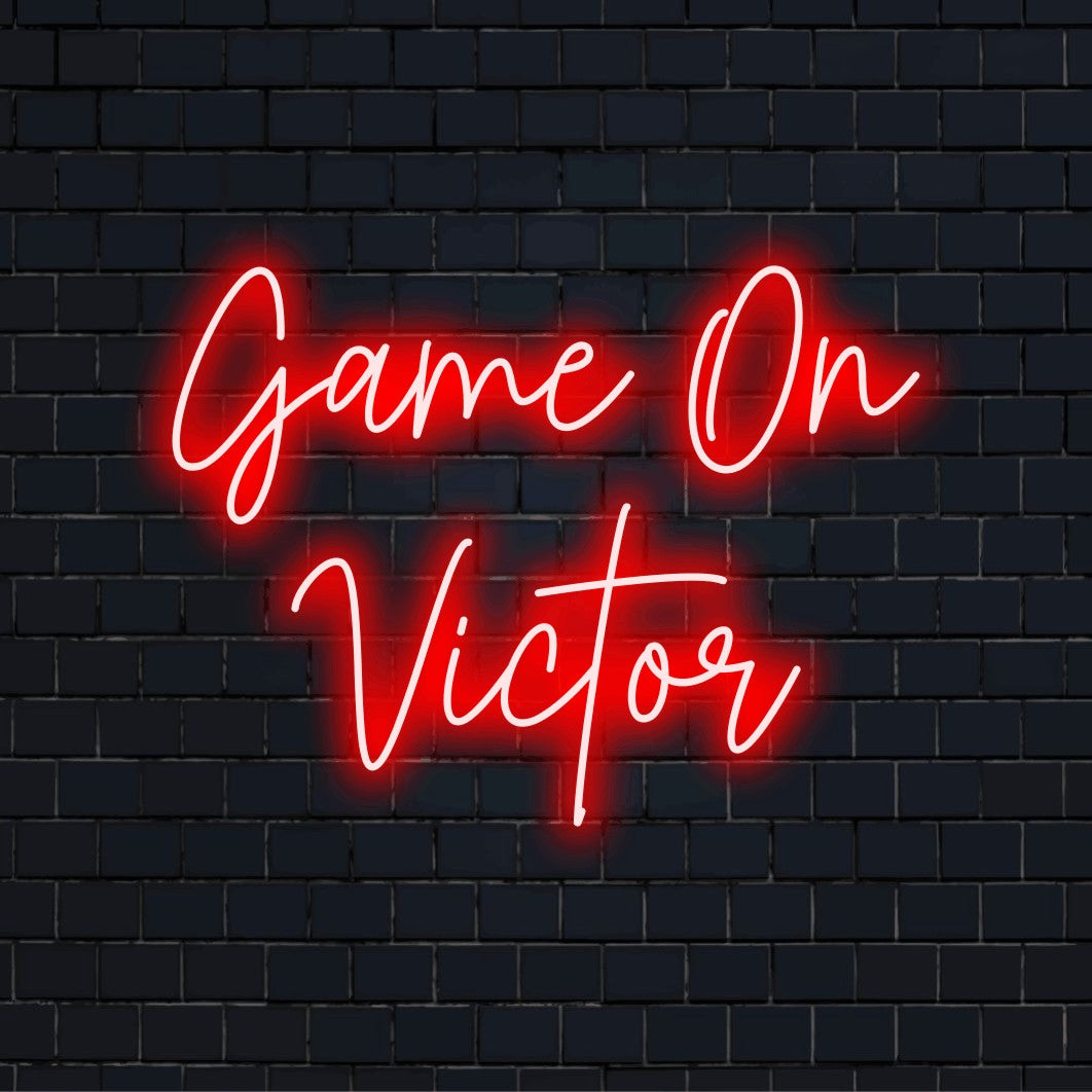 Game On Victor Custom Name Neon Sign, bright neon lettering on black brick background