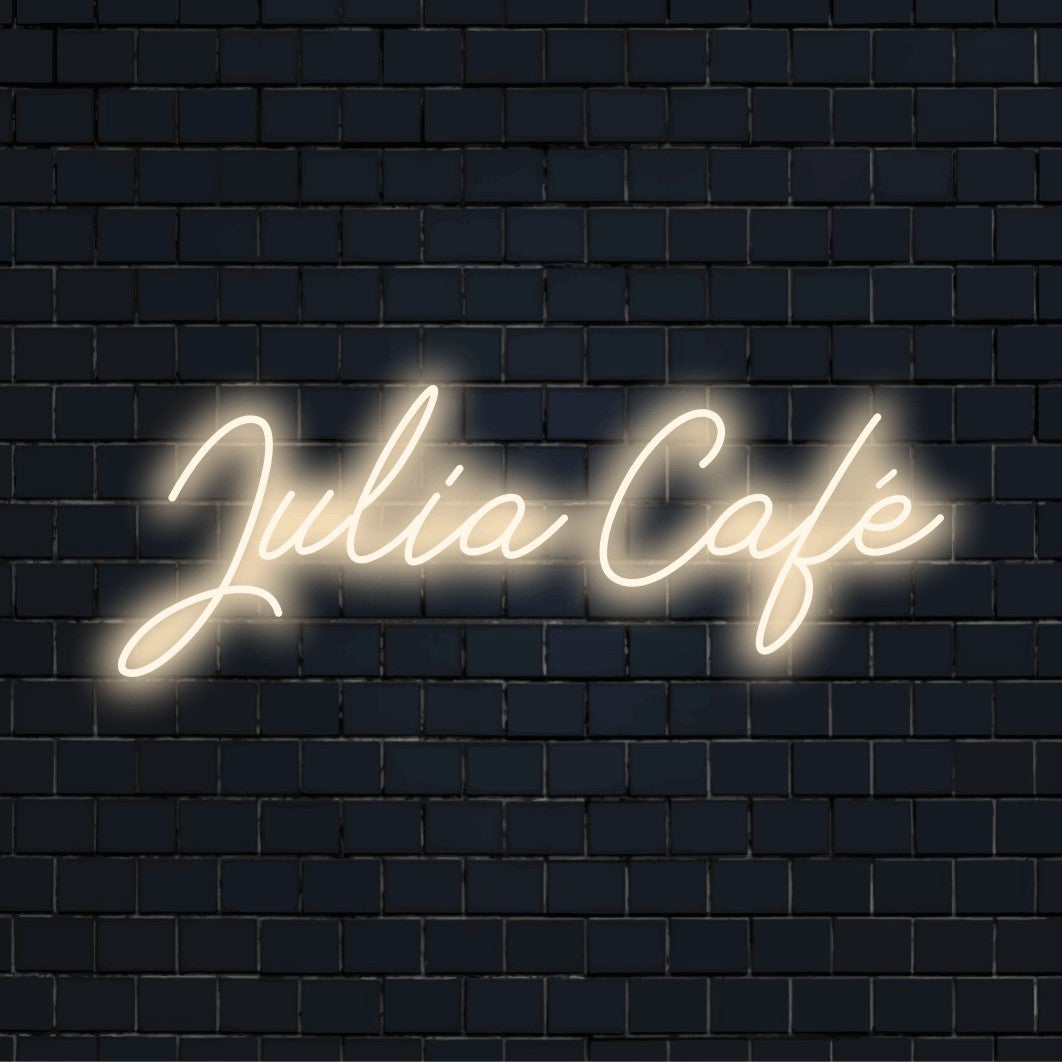 Julia Cafe Custom Name Neon Sign, bright neon glow on black brick background
