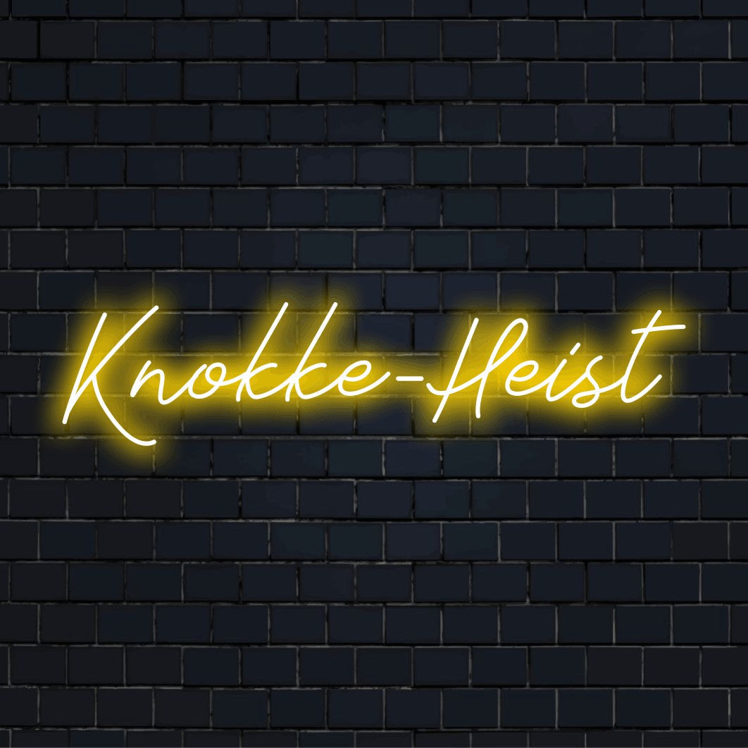 Knokke Heist LED Neon Sign, glowing lettering on dark brick wall