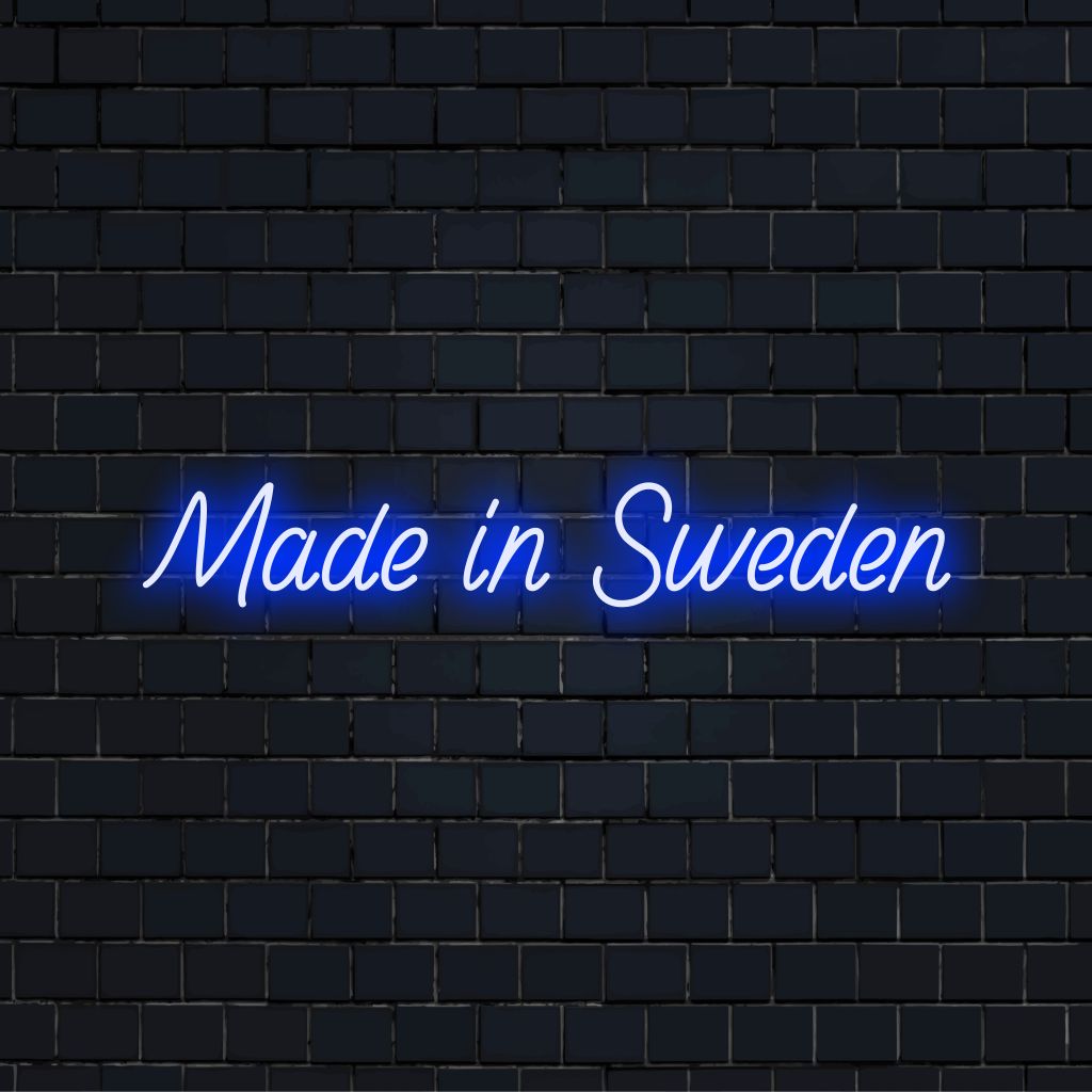 Made In Sweden Neon Light with bright neon lettering on dark brick wall