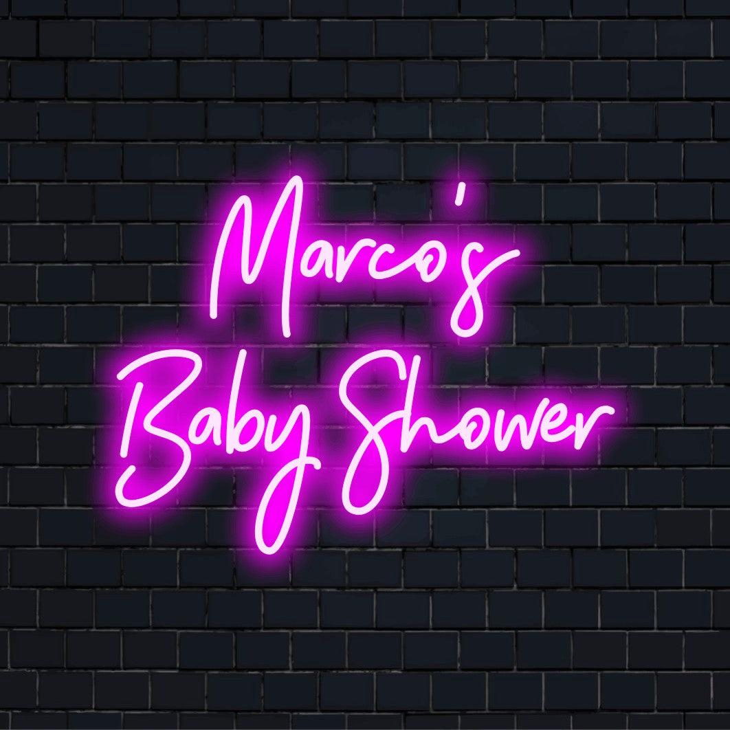 Marco_s Baby Shower Custom Name Neon Sign, glowing lettering on dark brick wall