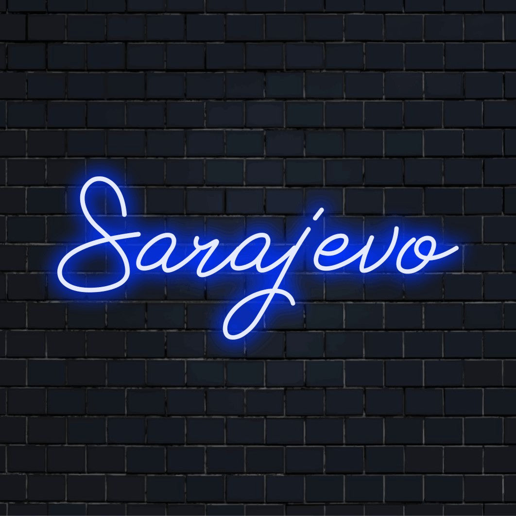 Sarajevo Neon Sign, glowing lettering against brick backdrop