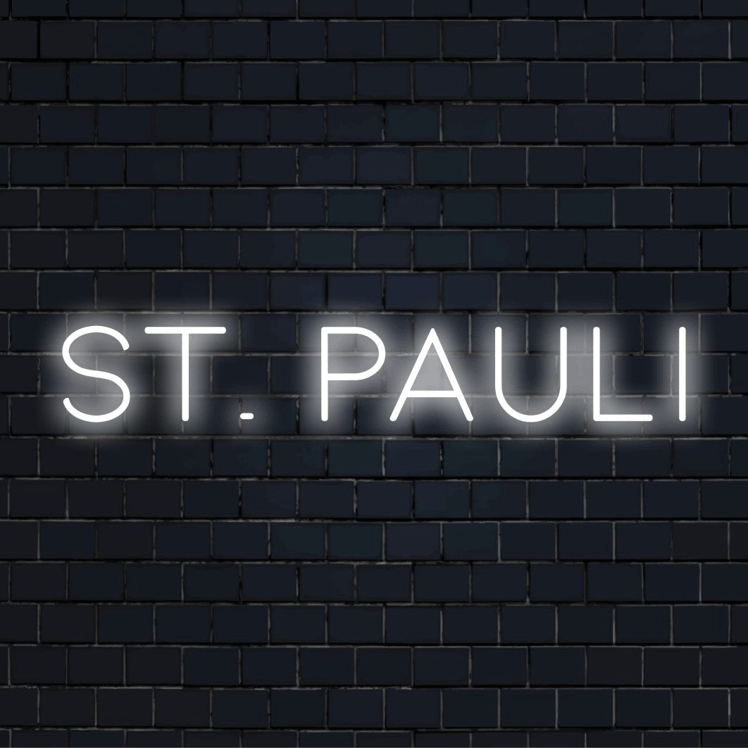 St Pauli Neon Sign, bright neon glow on black brick background