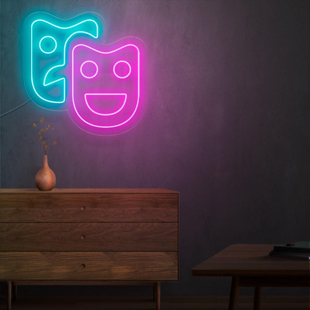 Um letreiro de neon hipnotizante com máscaras de teatro, simbolizando o drama e as artes cênicas. Este letreiro adiciona um toque de elegância e charme a qualquer local de entretenimento.