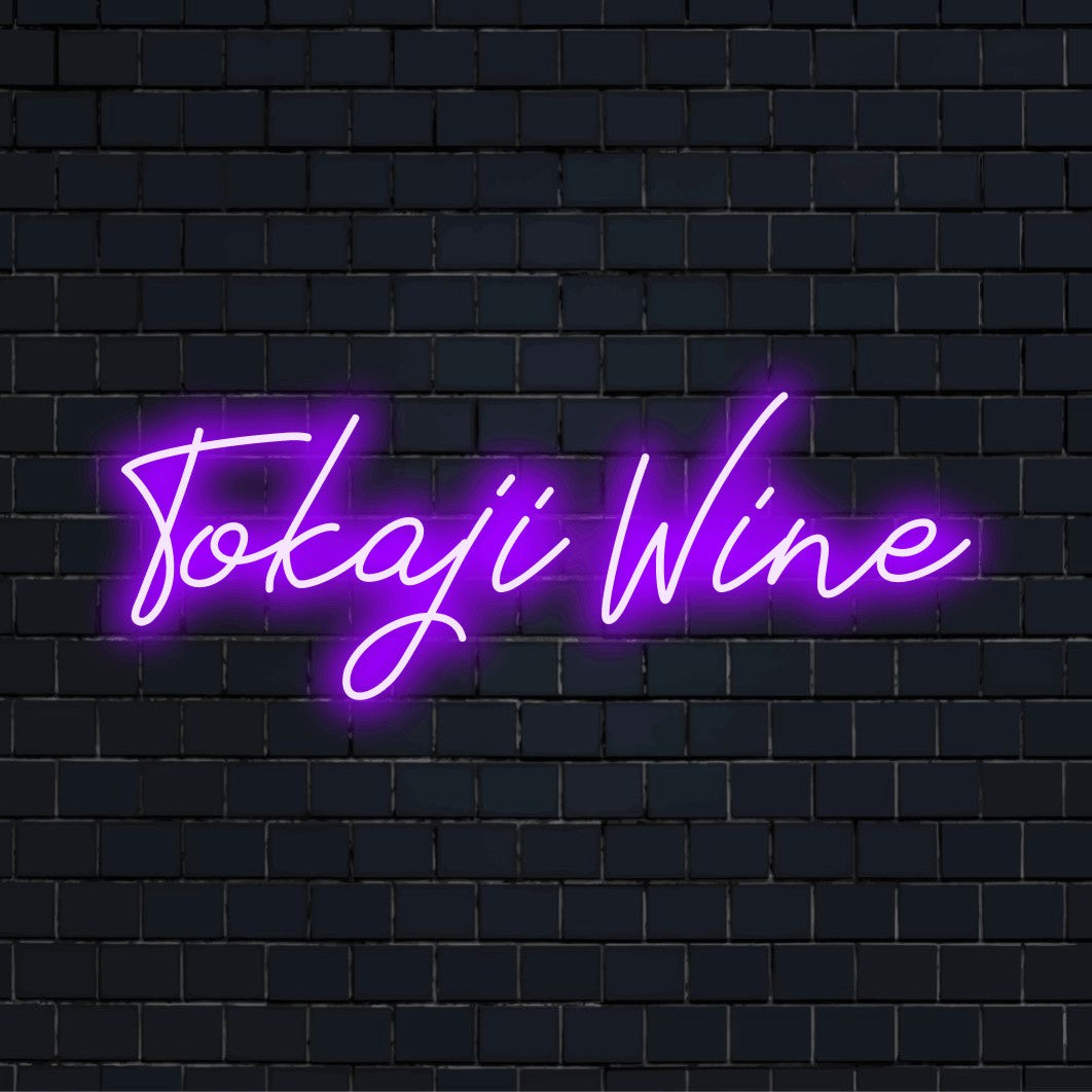 Tokaji Wine Neon Sign, glowing neon text on black brick background
