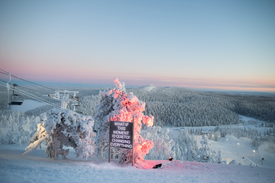 Outdoor neon art installation in a winter landscape