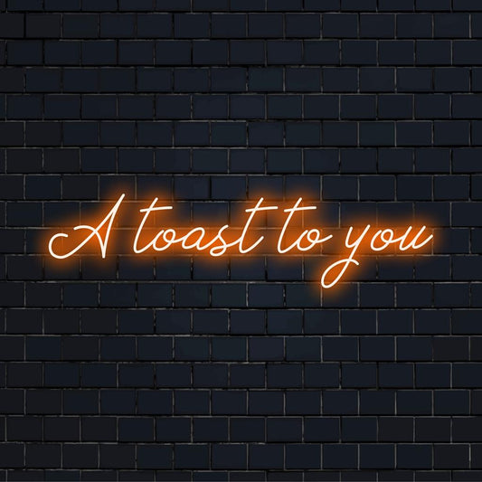 Custom LED neon sign featuring the phrase A Toast To You in vibrant colors, perfect for adding a celebratory touch to any space.