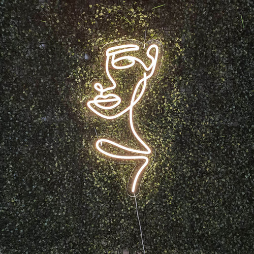 Letreiro de neon com rosto de mulher abstrata - The Art Neon