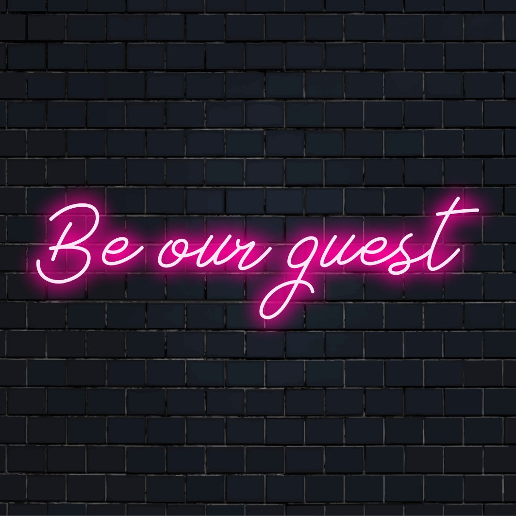 Letreiro de LED neon com a frase "Be Own Guest" personalizada em letras vibrantes e fluidas. Uma declaração de decoração elegante e personalizada.