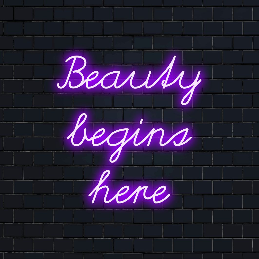 Letreiro de neon LED versátil com a frase "A beleza começa aqui", combinando arte com citações em neon com elementos de design LED personalizados.