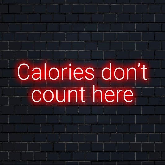 Custom LED neon sign displaying Calories Don't Count Here, ideal for adding a fun, personalized touch to any space.