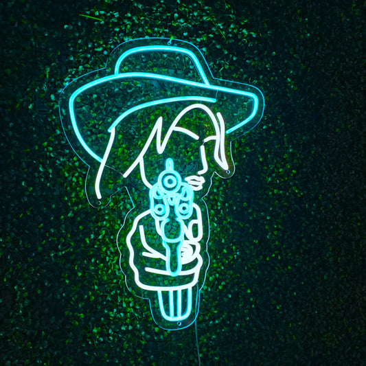 "Cowgirl Pointing Gun Neon Sign" – A bold neon light showcasing a cowgirl silhouette, infusing your space with daring energy.