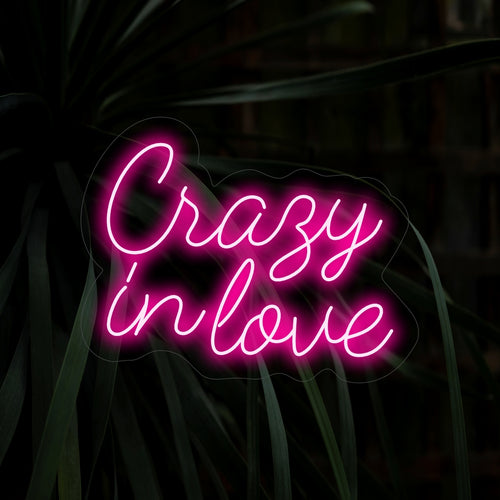 "Crazy In Love Neon Sign" – A passionate and romantic neon light displaying the words "Crazy In Love," infusing your space with fiery energy and heartfelt emotion.