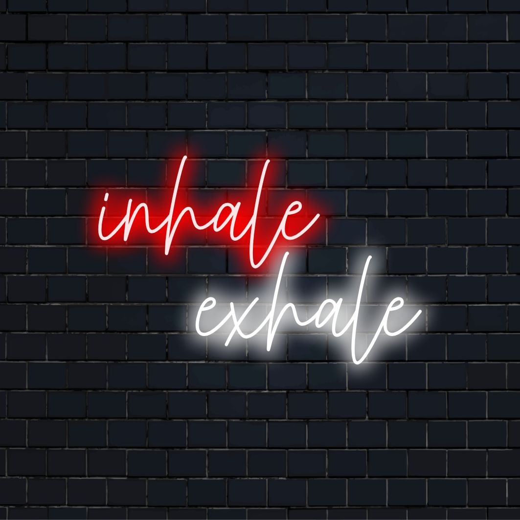 "Inhale Exhale Neon Sign" - Create a calming atmosphere with this neon light, reminding you to focus on your breath and embrace relaxation.