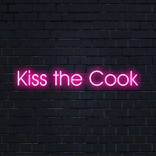 Custom LED neon sign reading Kiss The Cook, perfect for kitchen wall decor. Vibrant neon light adds a playful culinary touch.