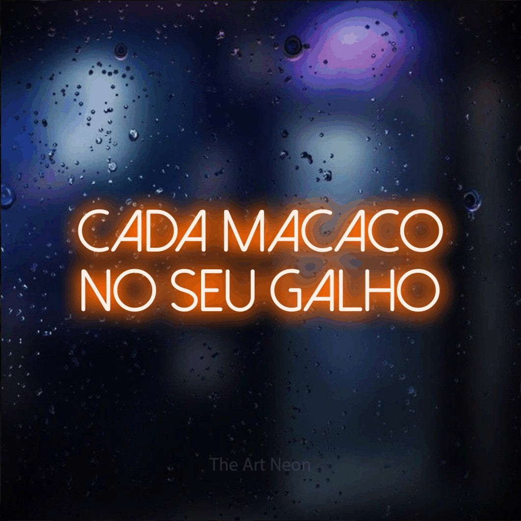 LED neon sign reading “Cada Macaco no Seu Galho”, arranged in 2 lines.