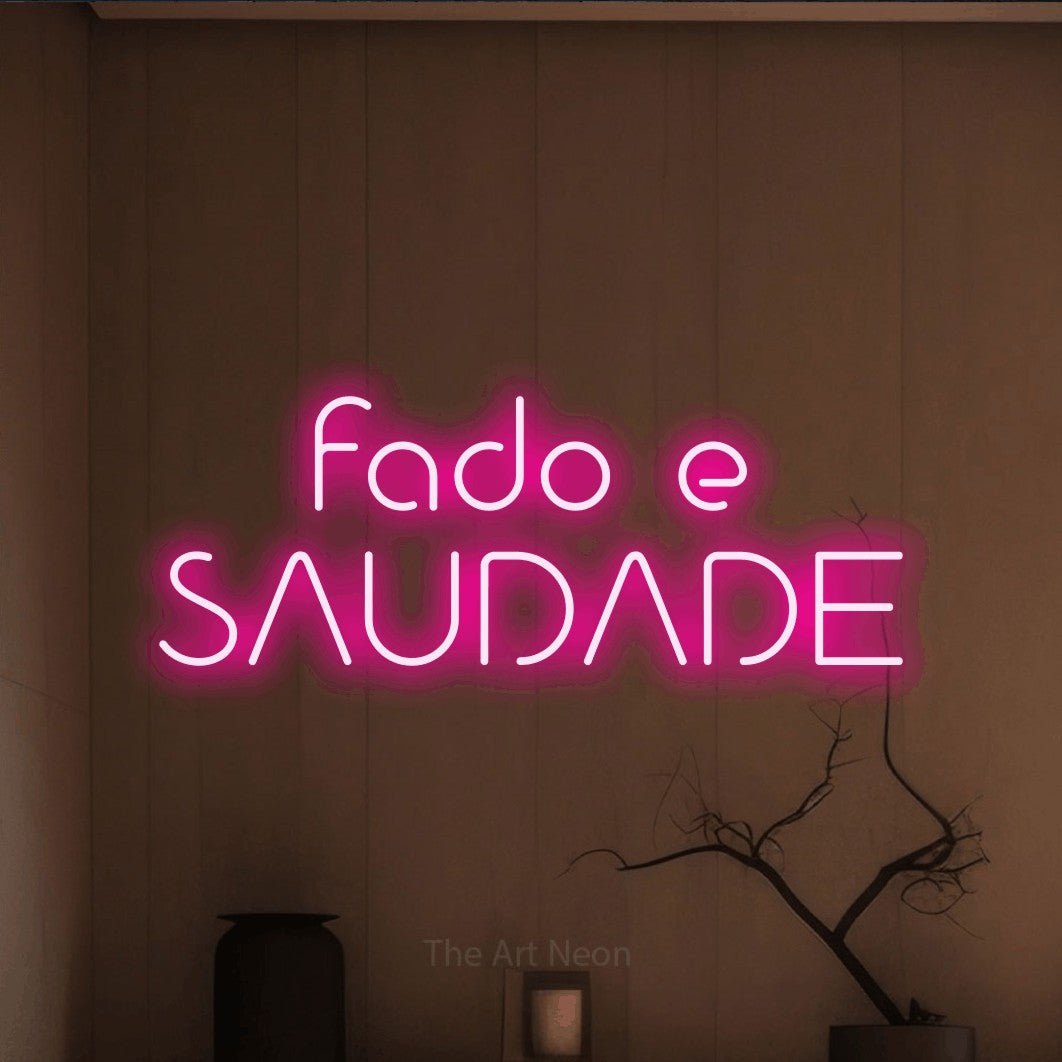 LED neon sign reading “fado e SAUDADE”, arranged in 2 lines.