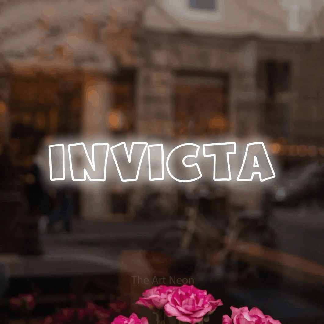 LED neon sign reading “Invicta”, arranged in a single line.