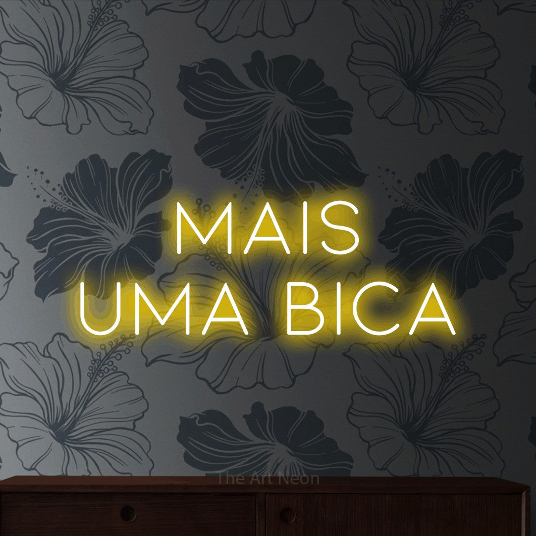 LED neon sign reading “mais uma bica”, arranged in 2 lines.