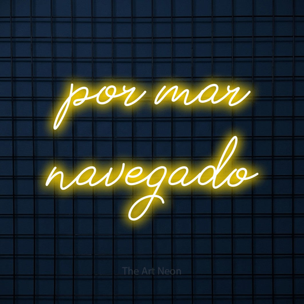 LED neon sign reading “por mar navegado”, arranged in 2 lines.