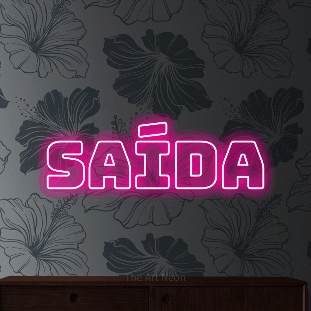 LED neon sign reading “Saída”, arranged in a single line.