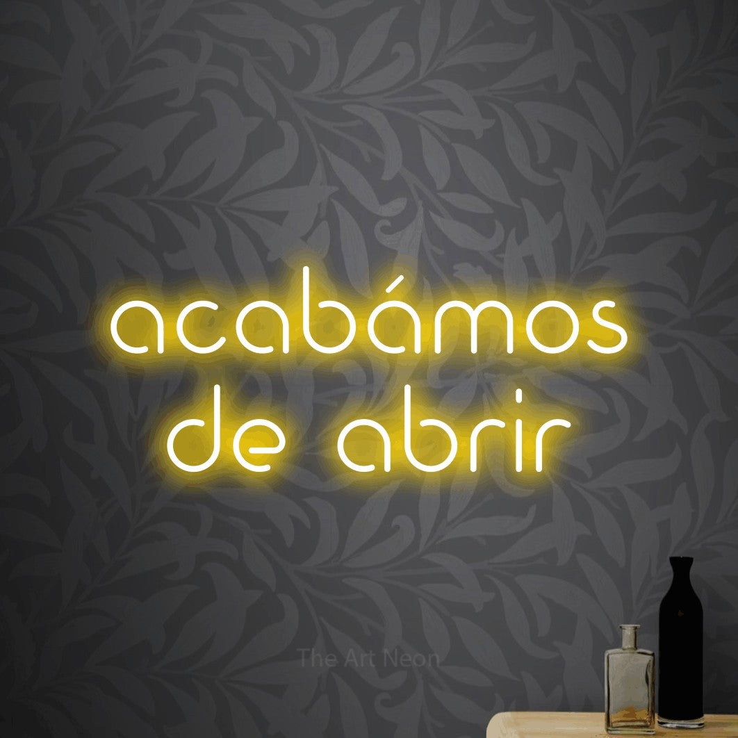 LED neon sign reading “acabámos de abrir”, arranged in 2 lines.