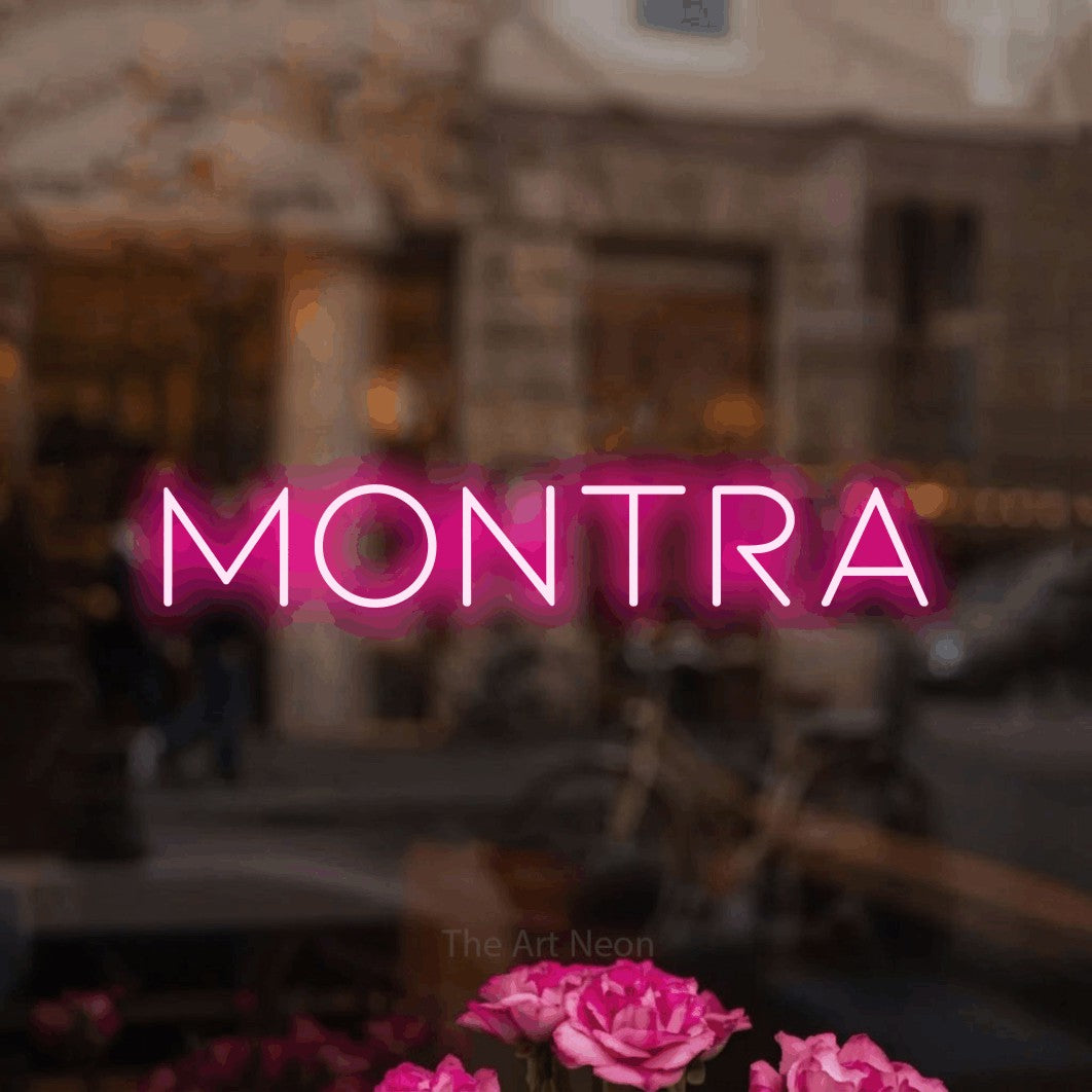 LED neon sign reading “Montra”, arranged in a single line.