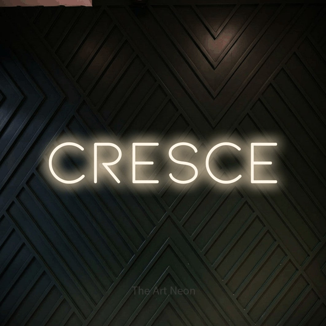 LED neon sign reading “Cresce”, arranged in a single line.