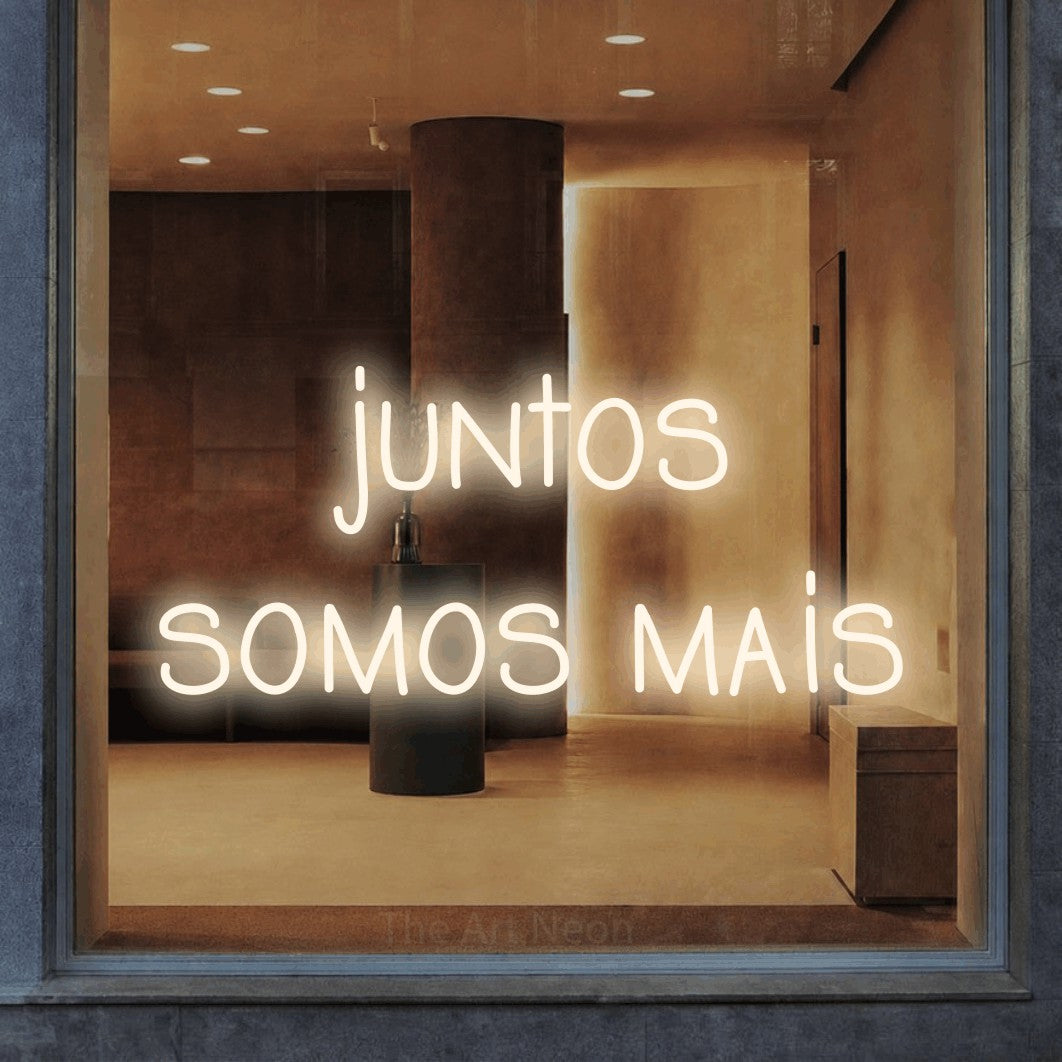 LED neon sign reading “juntos somos mais”, arranged in 2 lines.